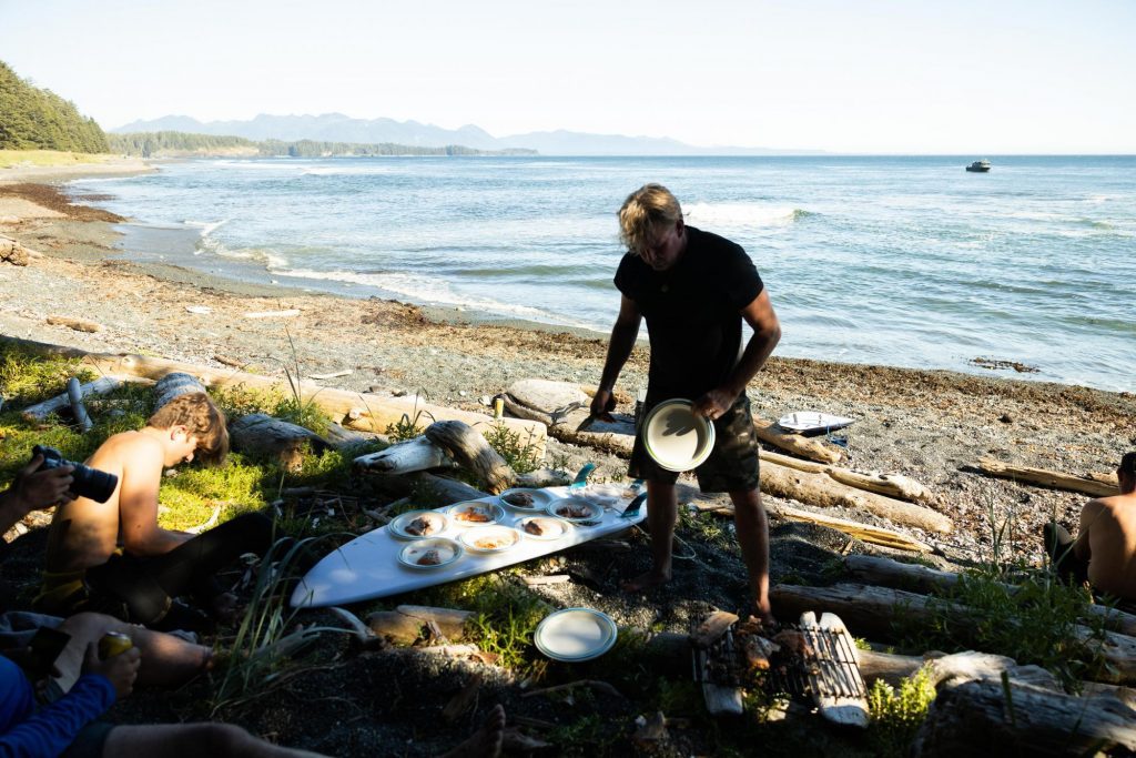Dinner is served on a surfboard for the hungry guests of Nootka Wilderness Lodge